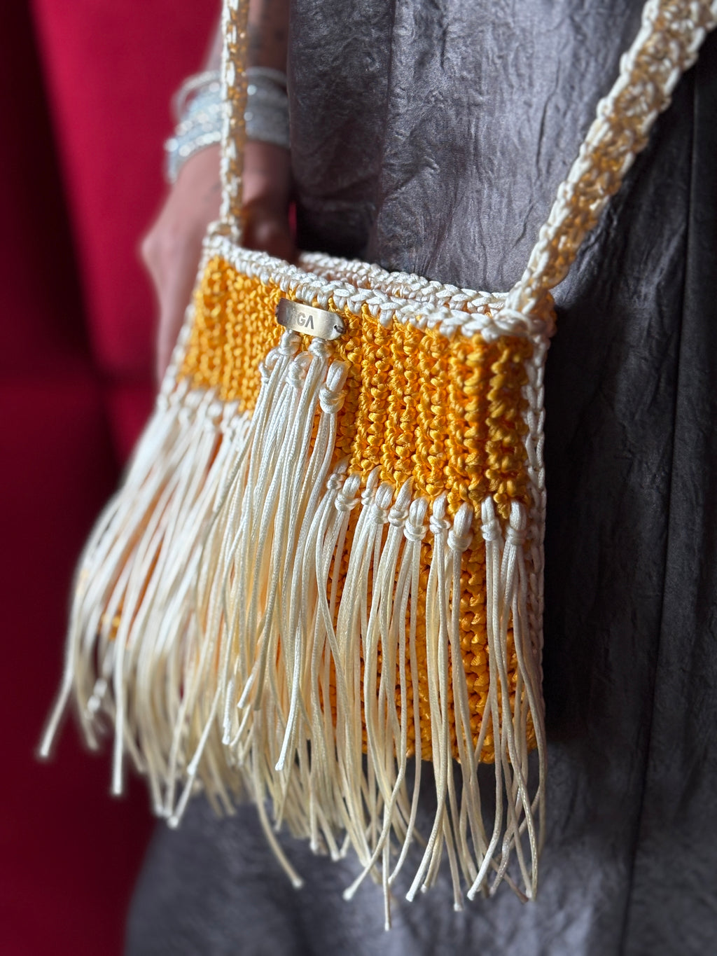 Handmade yellow and white crochet handbag with long shoulder strap