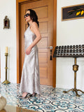 Side view of dusty rose strappy maxi dress showcasing elegant silhouette and soft drape