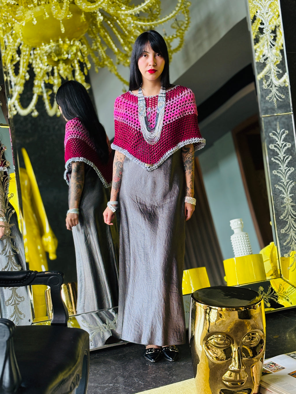 Colorful pink rainbow poncho styled for modern fashion look