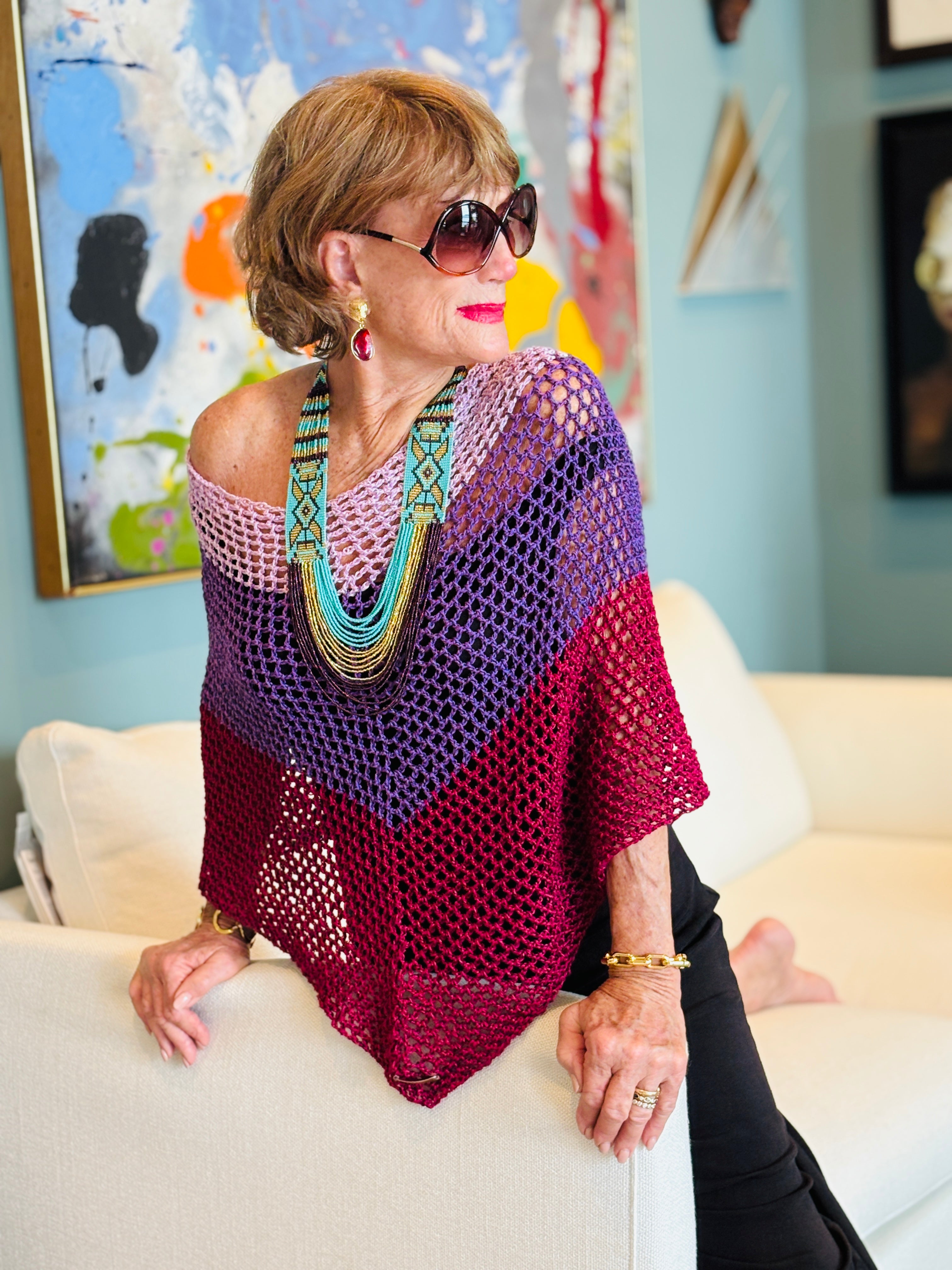 Front view of handmade pink purple poncho