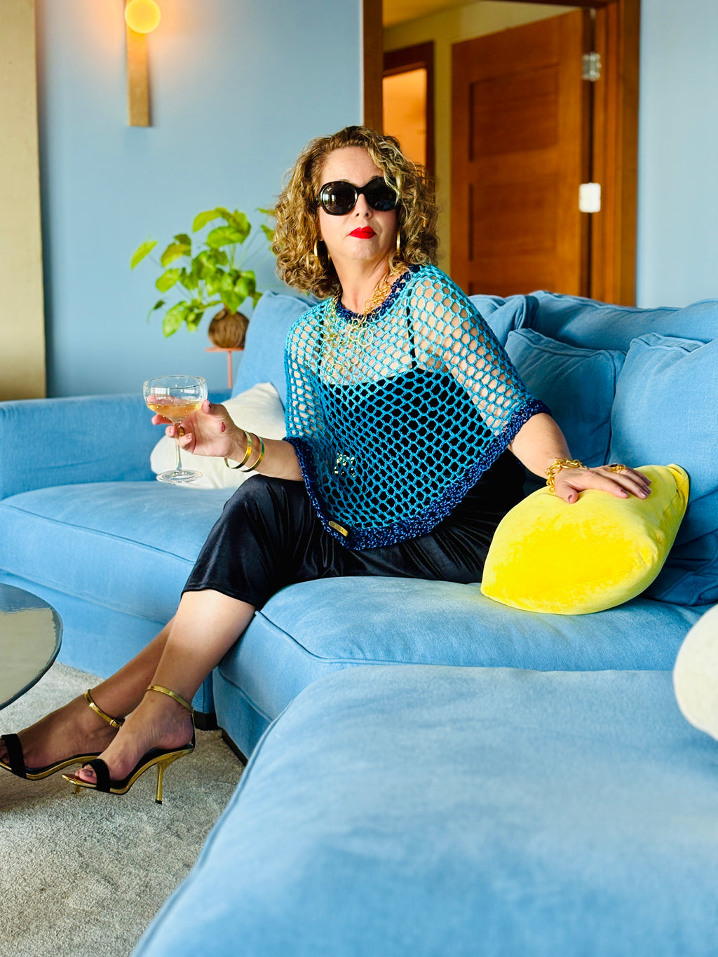 Elegant blue poncho styled casually with modern outfit