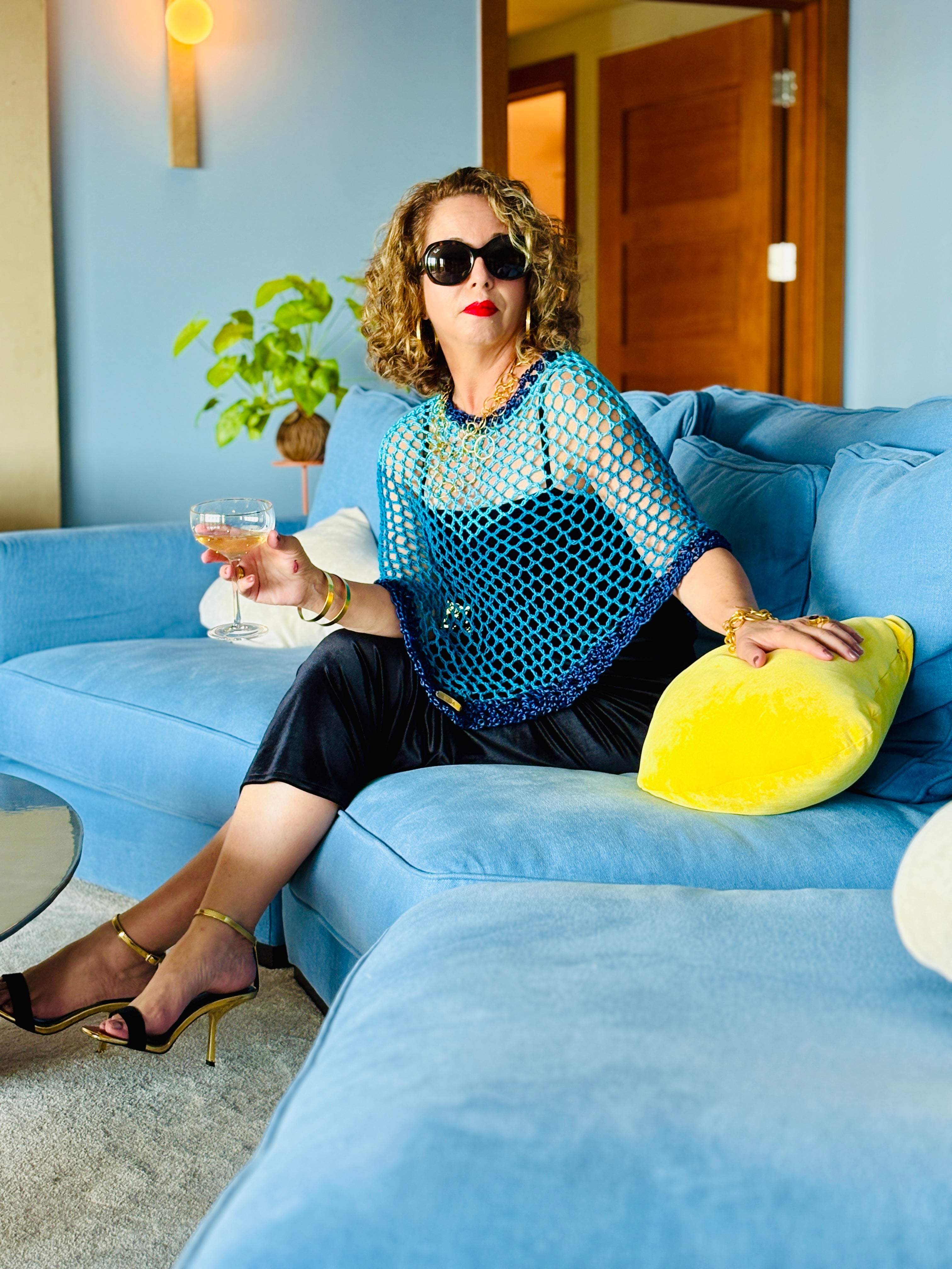Elegant blue poncho styled casually with modern outfit