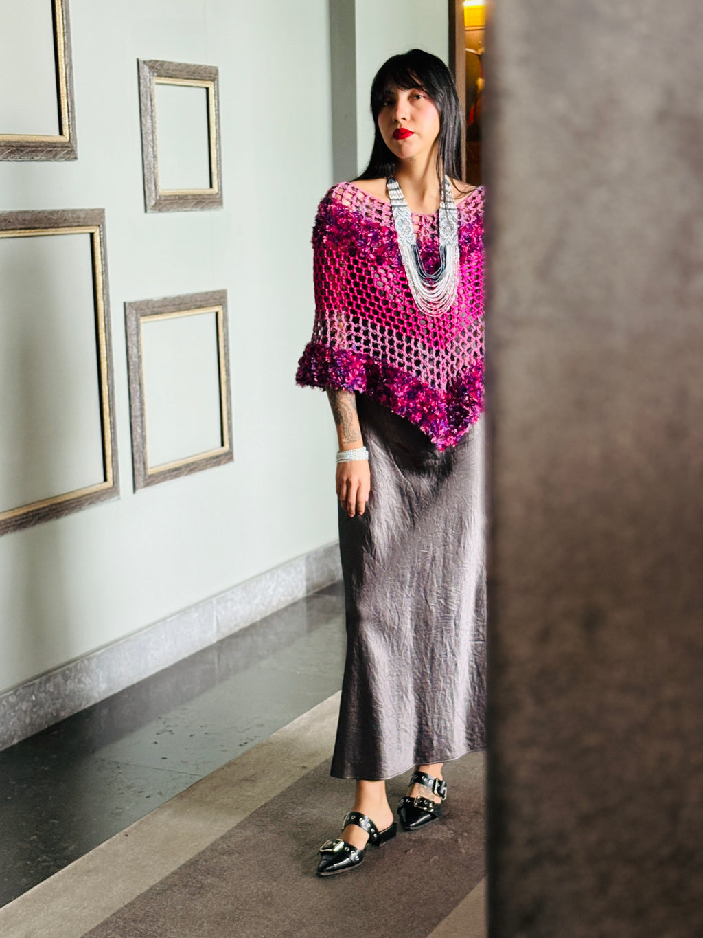Designer pink blend poncho showcasing modern silhouette