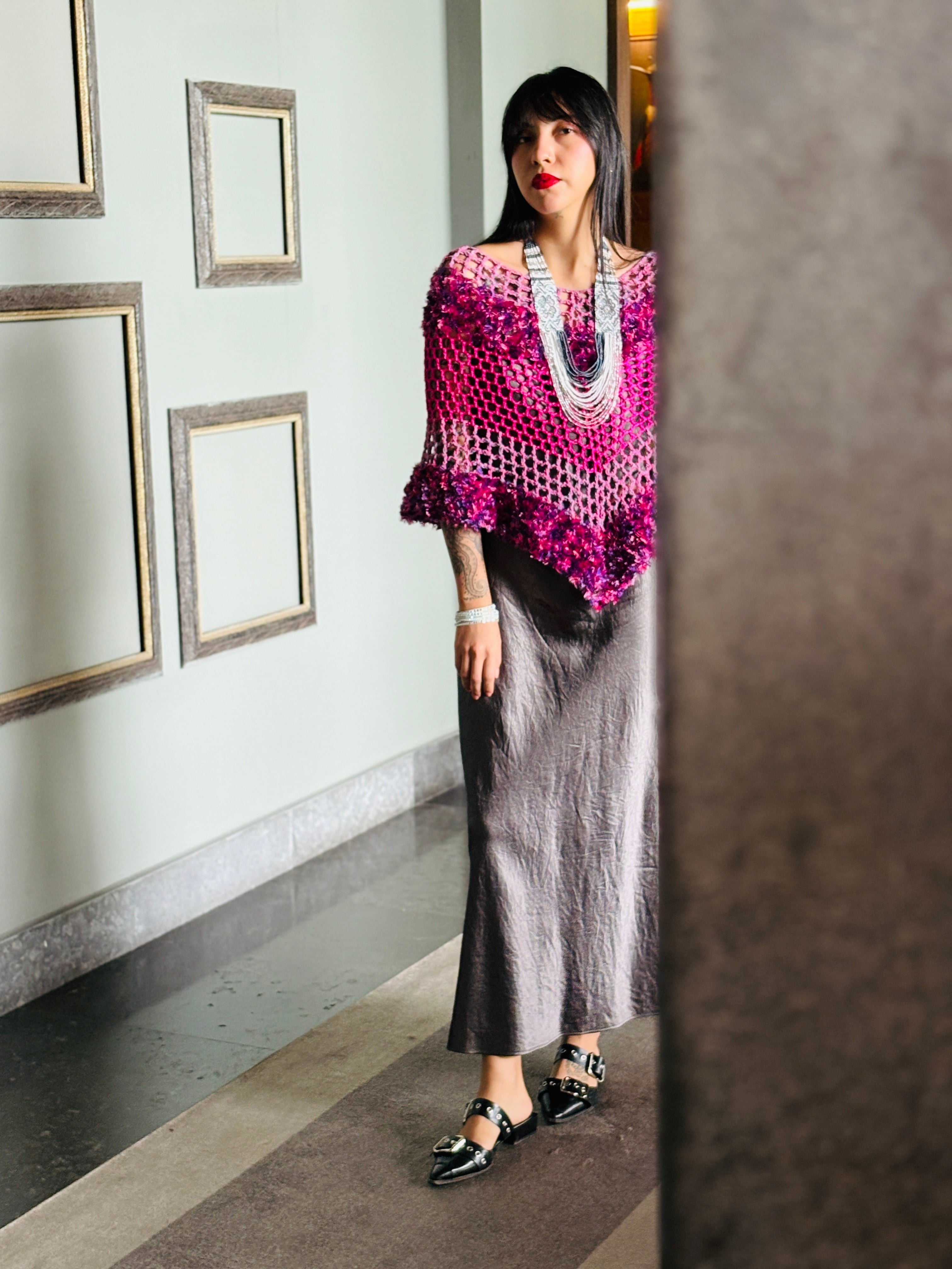 Designer pink blend poncho showcasing modern silhouette