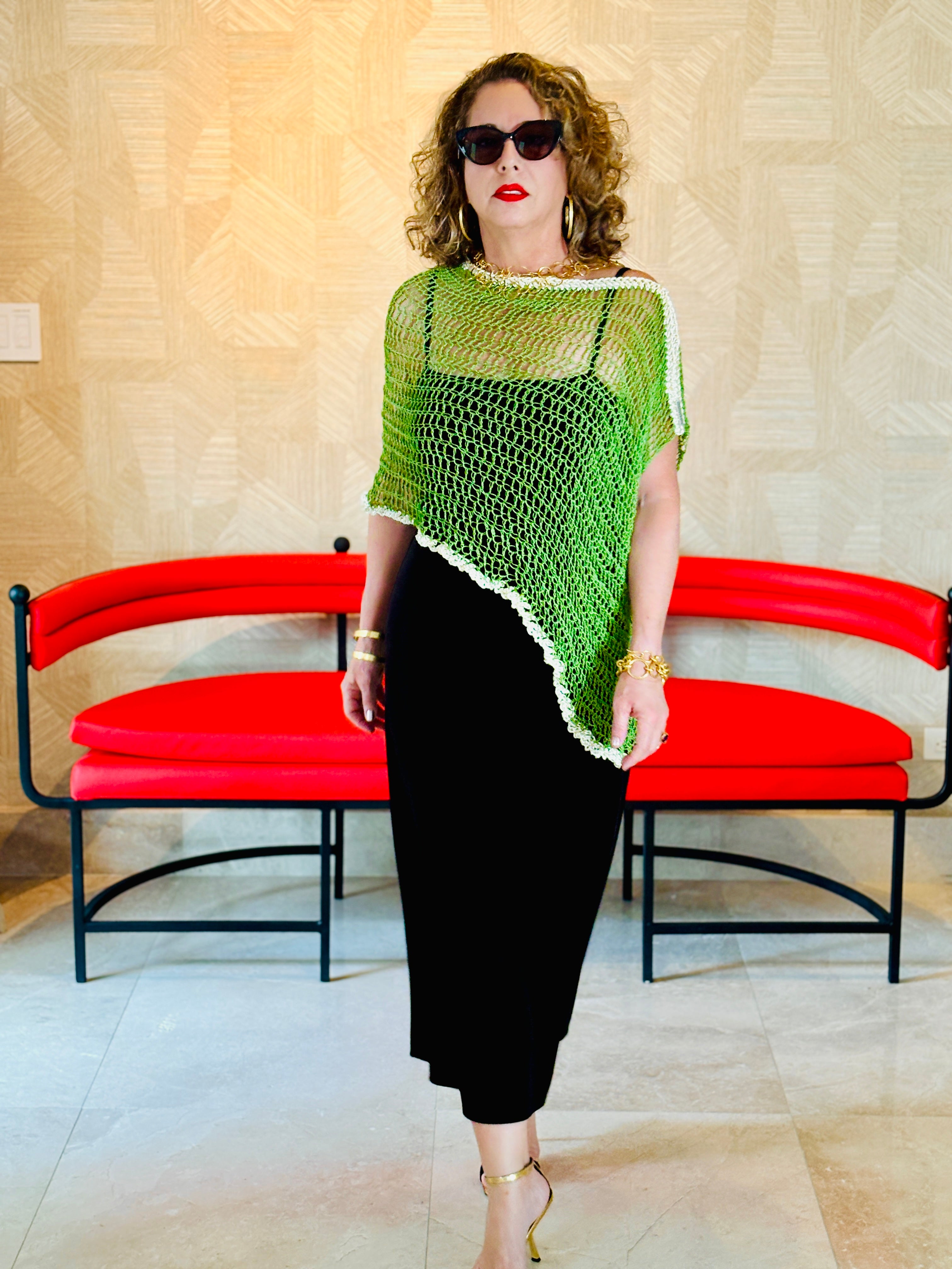 Green asymmetrical handmade poncho by Vega Fashion styled on model