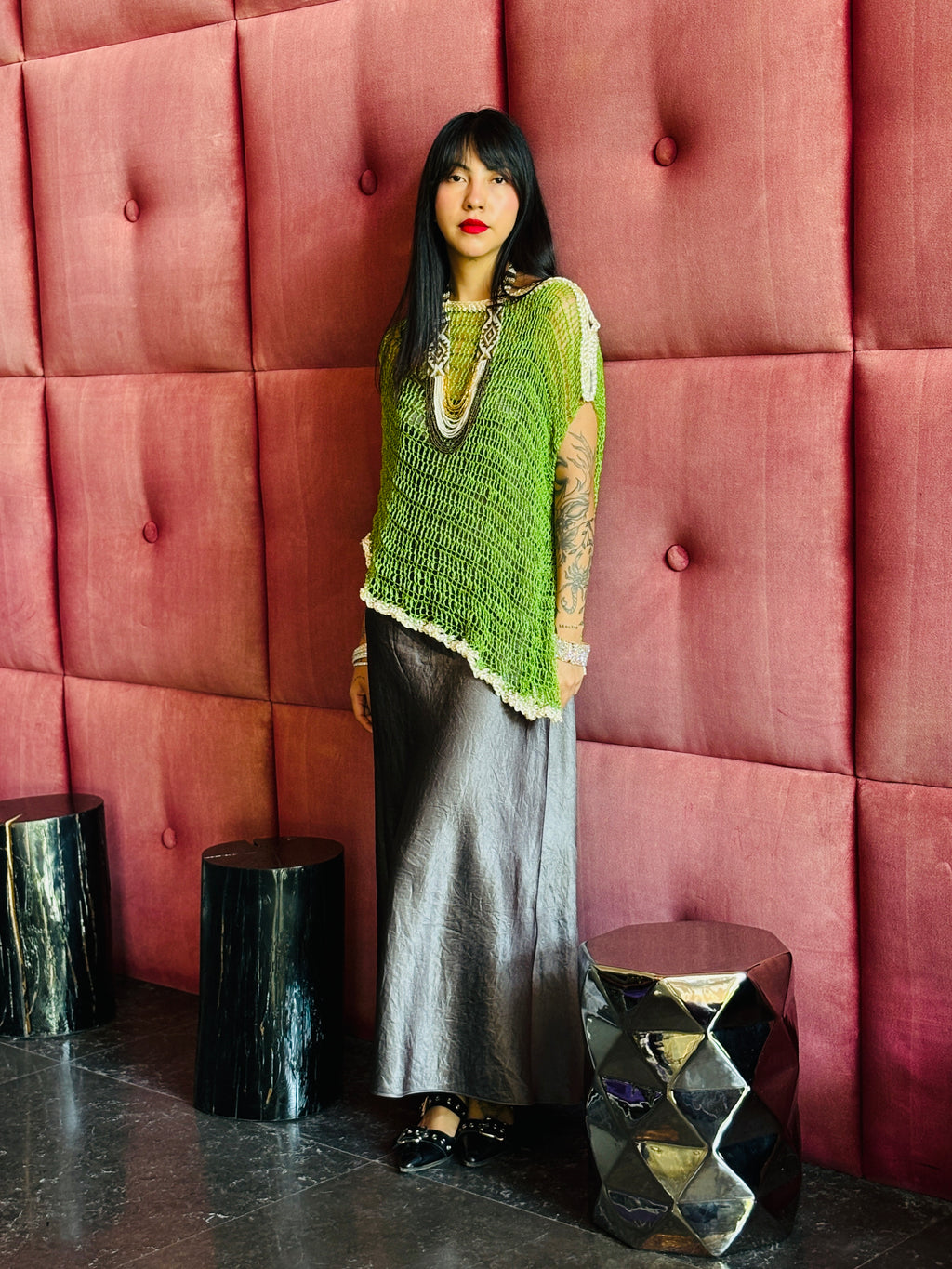 Green asymmetrical poncho styled for modern street fashion