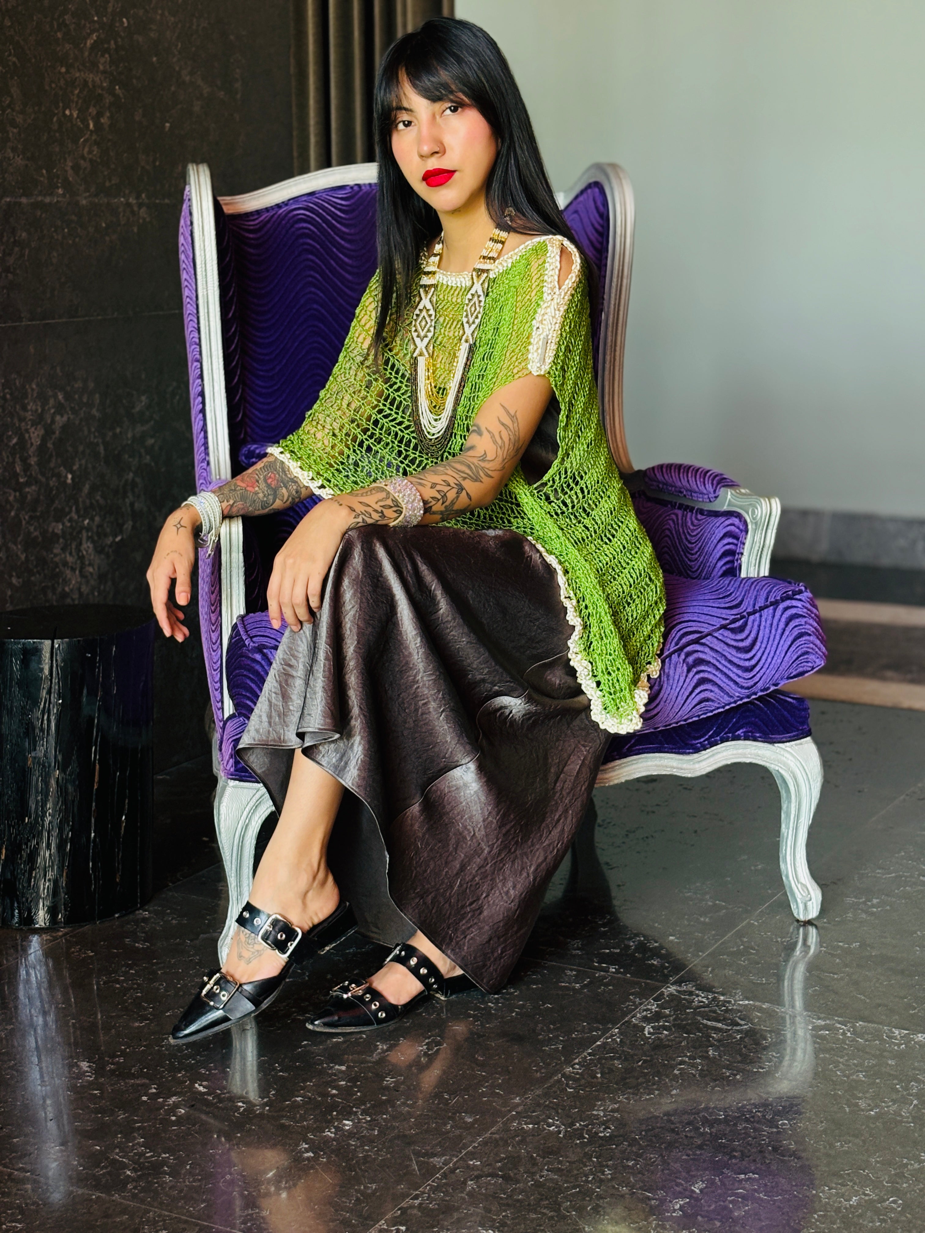 Side view of green handmade asymmetrical poncho