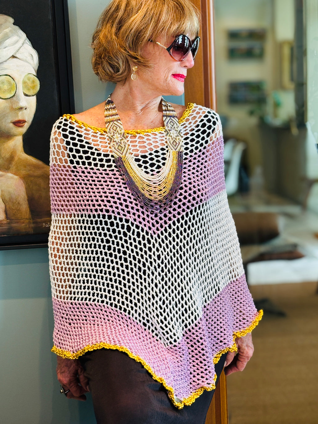 Side view of handmade white rose poncho