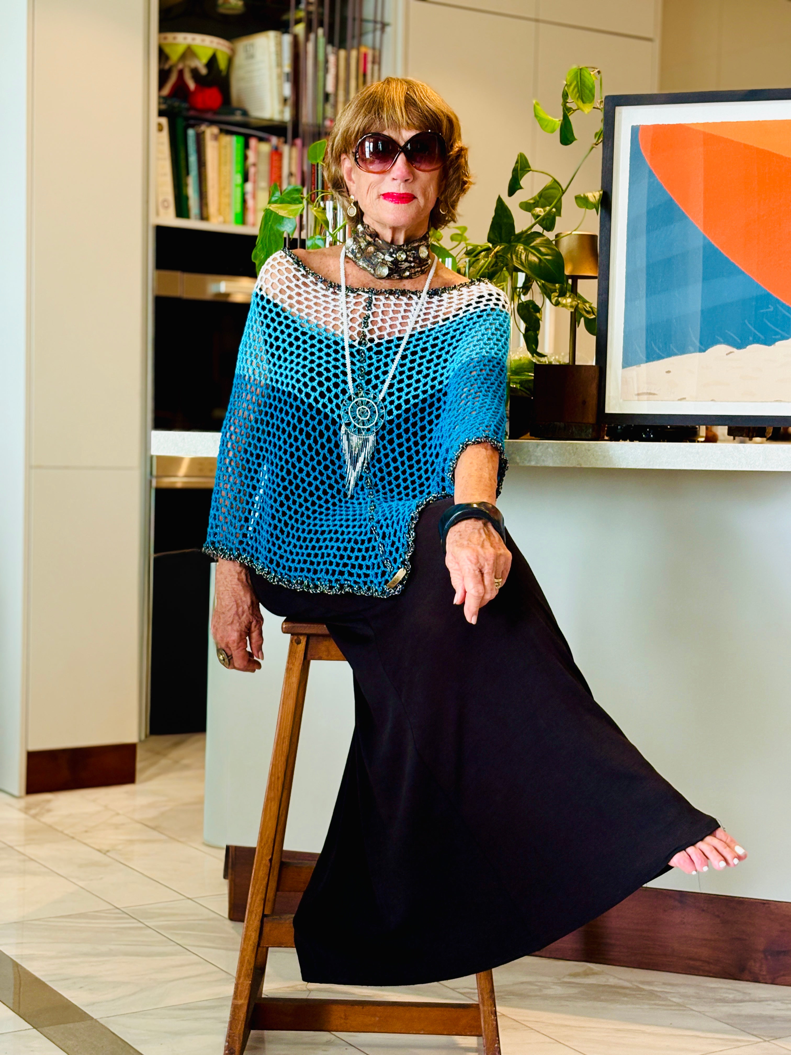 Handmade crochet Stillwater poncho by Vega Fashion styled on model