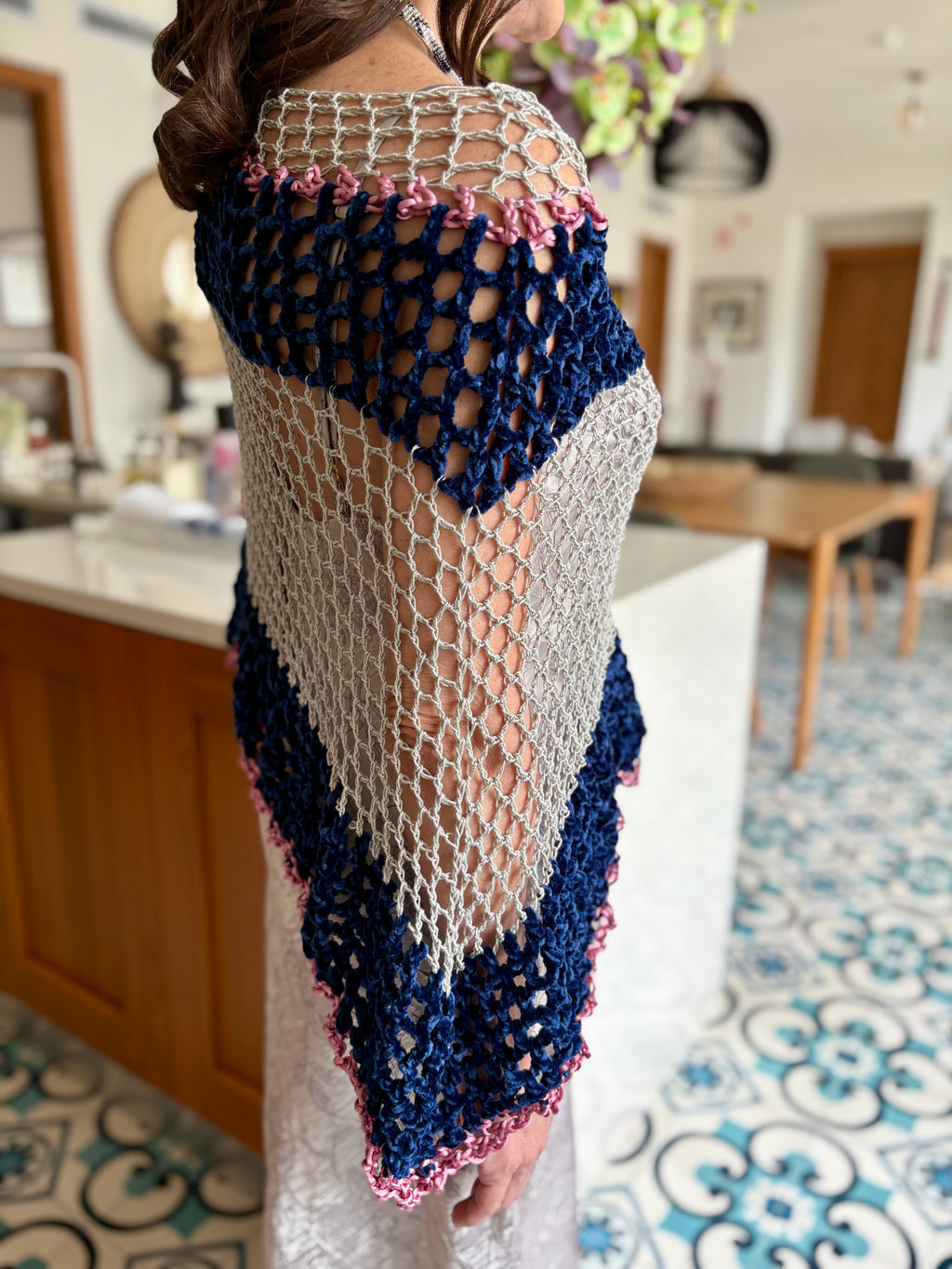 Close-up of navy grey velvet poncho highlighting soft texture and intricate crochet craftsmanship